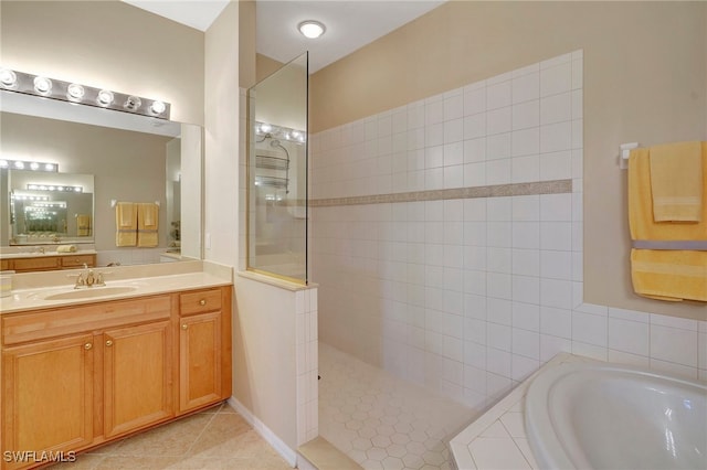 bathroom featuring vanity, separate shower and tub, and tile patterned floors