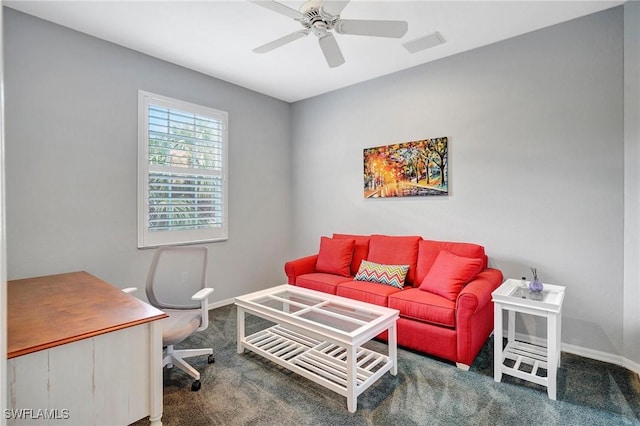 interior space with ceiling fan, visible vents, and baseboards