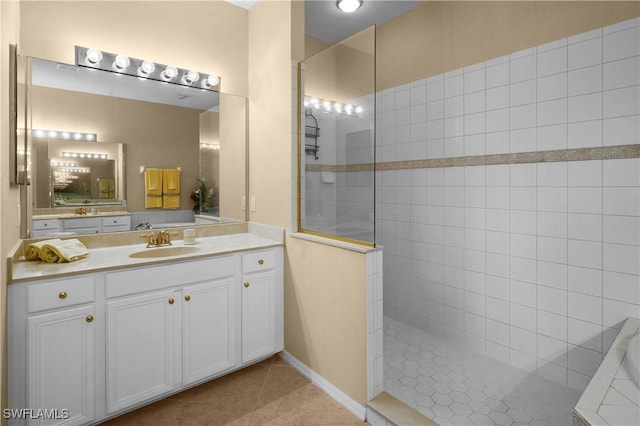 bathroom featuring tile patterned floors, vanity, and walk in shower