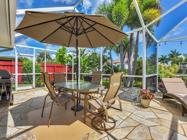 view of patio / terrace with a lanai and grilling area