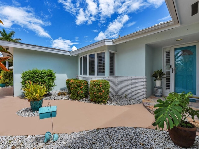 property entrance with a patio