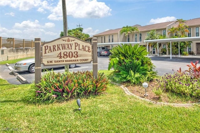 4803 SW Santa Barbara Ct Unit 2, Cape Coral, FL 33914 - community / neighborhood sign with covered parking and a lawn