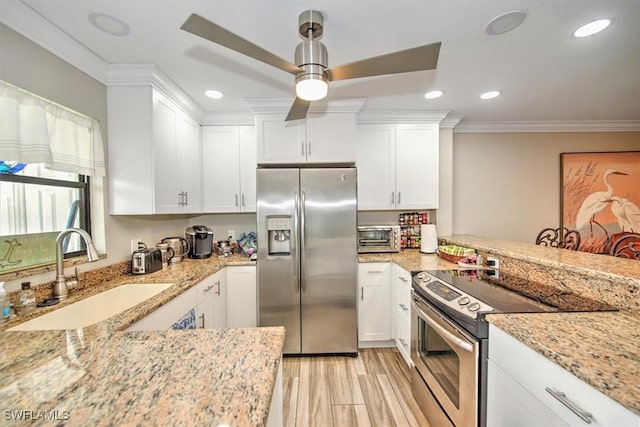 4803 SW Santa Barbara Ct Unit 2, Cape Coral, FL 33914 - kitchen featuring crown molding, ceiling fan, light stone counters, stainless steel appliances, and a sink
