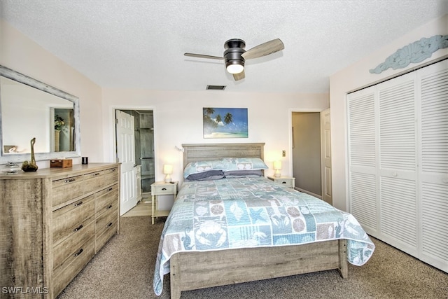 bedroom with a textured ceiling, carpet, ceiling fan, and a closet