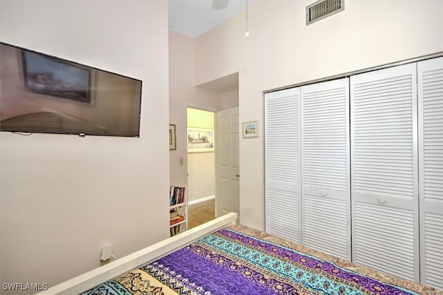 carpeted bedroom featuring a closet