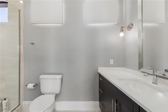 full bath featuring toilet, baseboards, and vanity