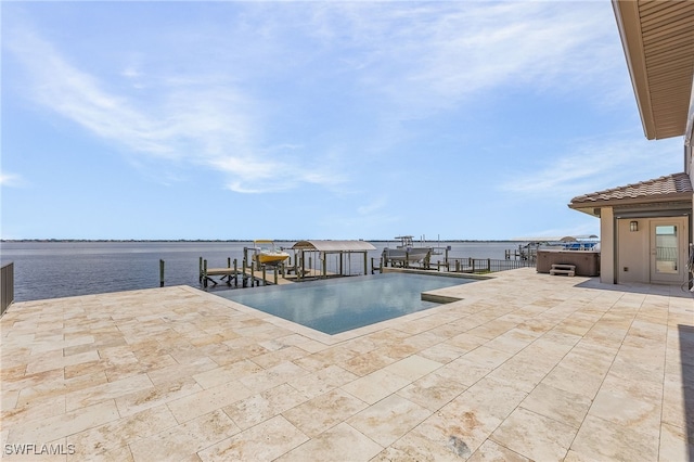 view of swimming pool featuring a dock, a water view, a hot tub, and a patio area