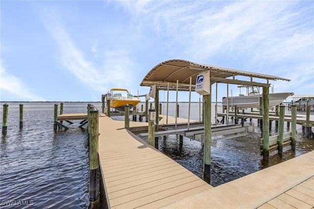 dock area featuring a water view and boat lift