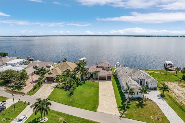 birds eye view of property with a water view