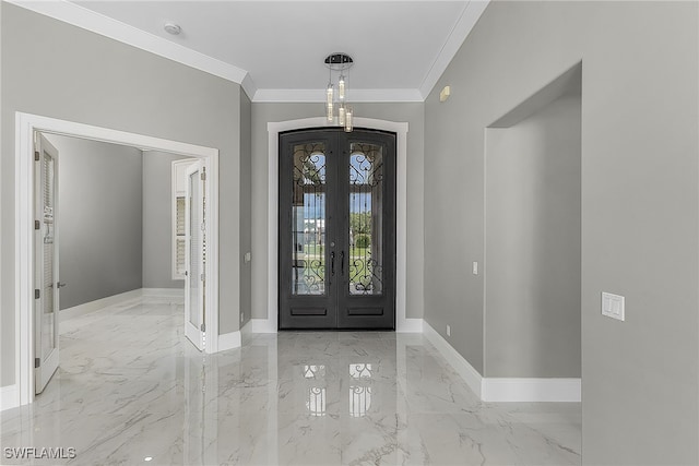 foyer entrance with french doors and crown molding