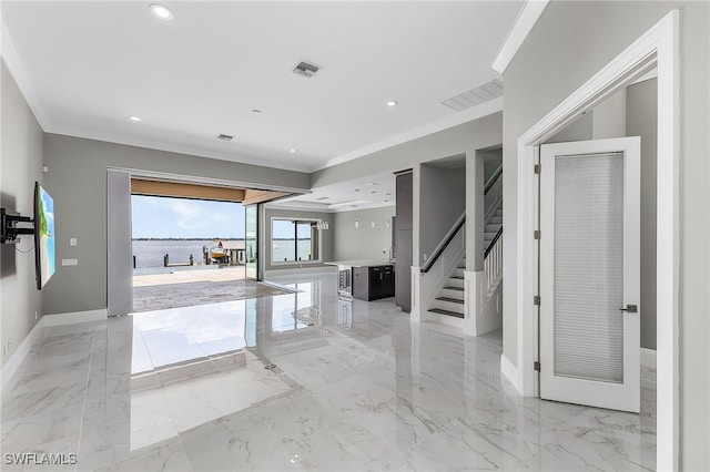 interior space with a water view and ornamental molding