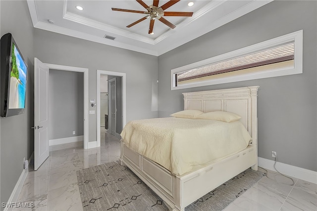 bedroom featuring ceiling fan, a raised ceiling, and ornamental molding