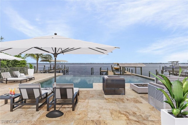 outdoor pool featuring a water view, a patio, boat lift, and a boat dock