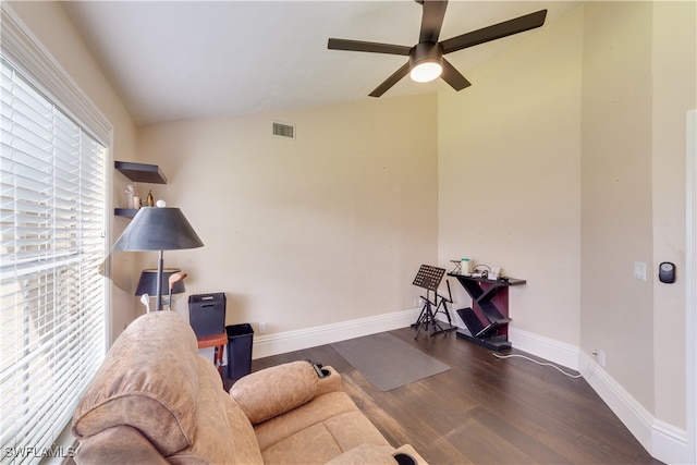 sitting room with vaulted ceiling, dark hardwood / wood-style floors, and ceiling fan