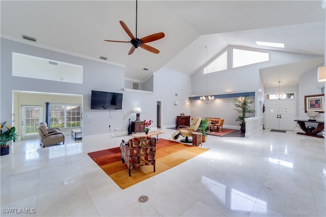 tiled living room featuring high vaulted ceiling, ceiling fan, and a skylight