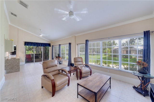 living room featuring a healthy amount of sunlight, lofted ceiling, light tile patterned floors, and ceiling fan