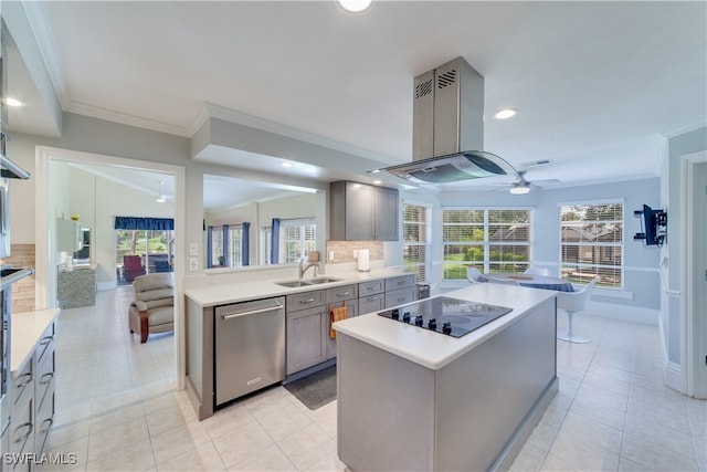 kitchen with decorative backsplash, dishwasher, ceiling fan, and a kitchen island