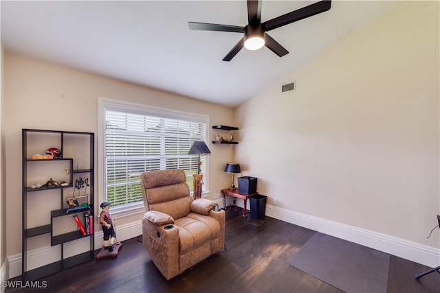 sitting room featuring ceiling fan, dark wood-type flooring, and vaulted ceiling