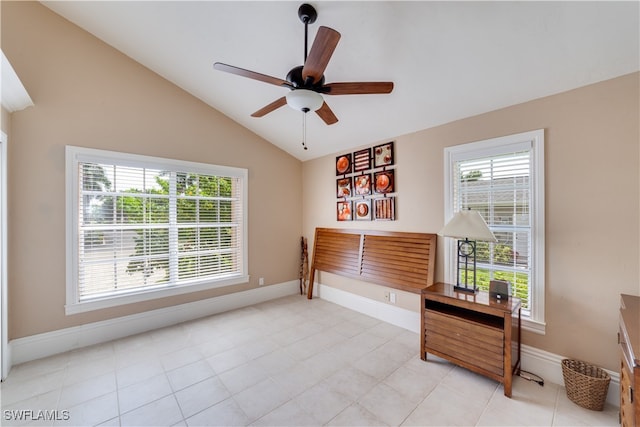 miscellaneous room with light tile patterned floors, vaulted ceiling, and ceiling fan