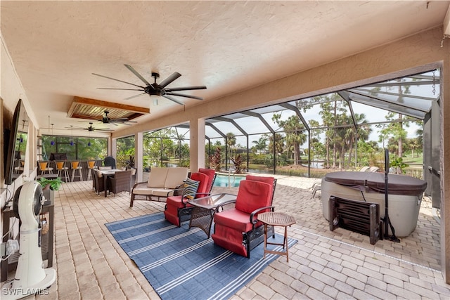 view of patio featuring glass enclosure, ceiling fan, outdoor lounge area, and a pool