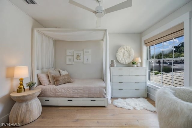 bedroom featuring ceiling fan and light hardwood / wood-style floors