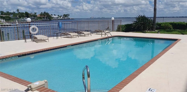 4015 SE 20th Pl Unit 206, Cape Coral, FL 33904 - community pool with a water view and a patio area