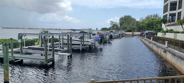 view of dock featuring a water view and boat lift