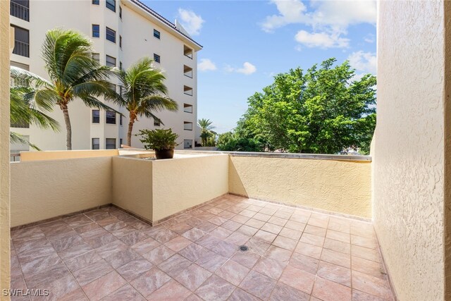 view of patio featuring a balcony