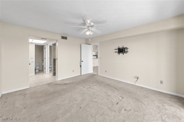 carpeted empty room with ceiling fan