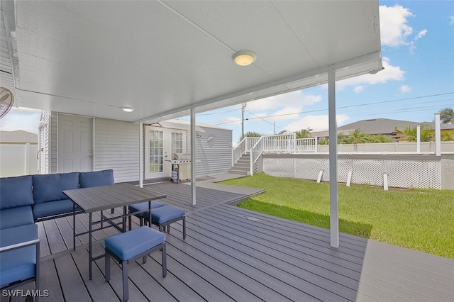 wooden terrace featuring a yard and an outdoor hangout area