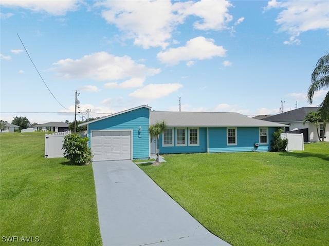 single story home featuring a front lawn and a garage