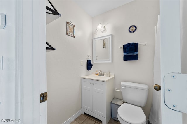 bathroom featuring vanity, toilet, and tile patterned floors