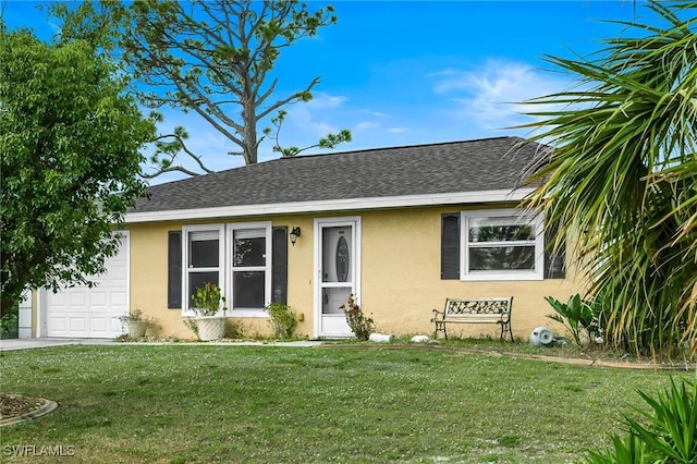 view of front of house featuring a garage, a shingled roof, a front yard, and stucco siding