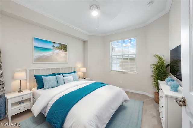 bedroom featuring ceiling fan, light carpet, and ornamental molding