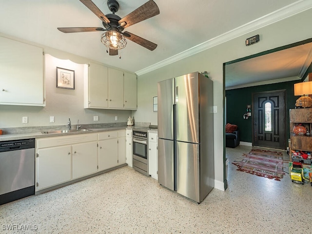 kitchen featuring appliances with stainless steel finishes, crown molding, sink, ceiling fan, and white cabinets