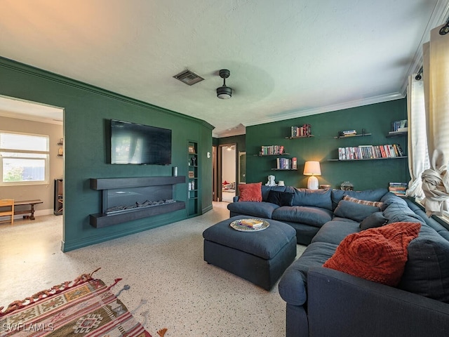 living room featuring ornamental molding and ceiling fan