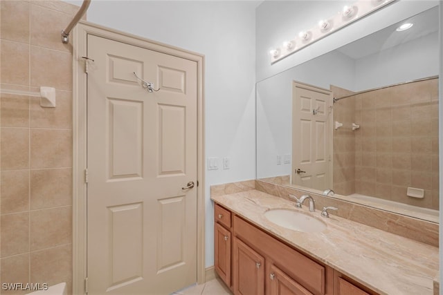 bathroom featuring tile patterned flooring and vanity