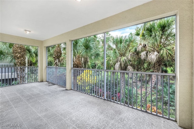 unfurnished sunroom with a wealth of natural light