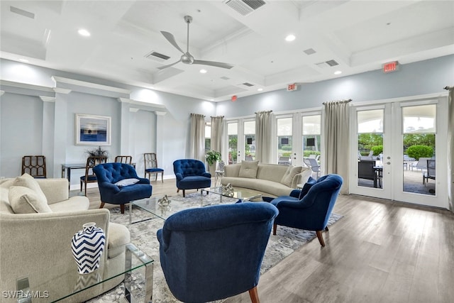 living room with french doors, light hardwood / wood-style flooring, a wealth of natural light, and coffered ceiling