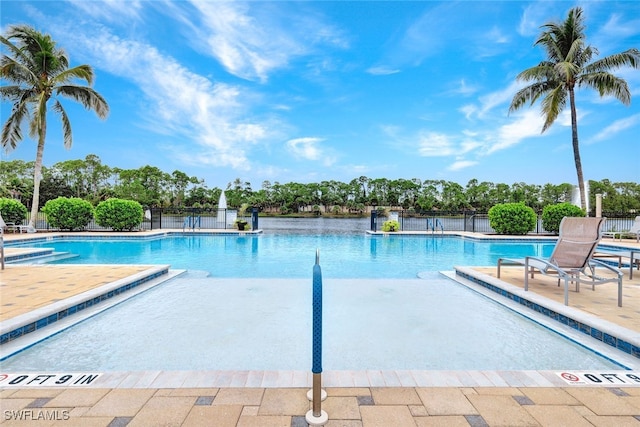 view of swimming pool with a patio area