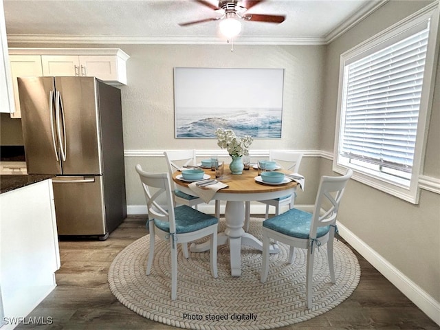 dining room featuring ceiling fan, crown molding, and hardwood / wood-style floors