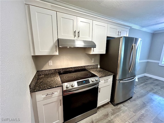 kitchen with stainless steel appliances and white cabinetry