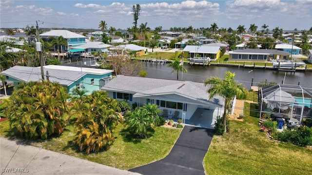 birds eye view of property with a water view