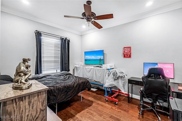 bedroom featuring crown molding, ceiling fan, and wood-type flooring