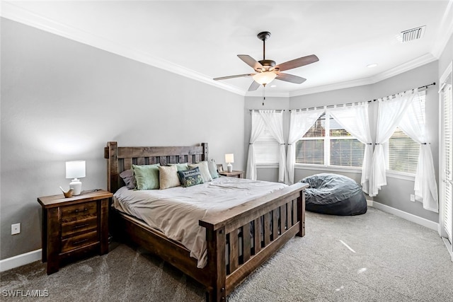 bedroom featuring ceiling fan, ornamental molding, and carpet floors