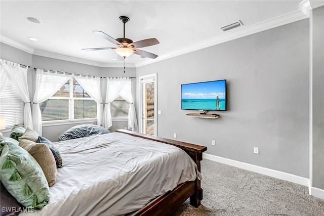 bedroom with ceiling fan, ornamental molding, and carpet floors