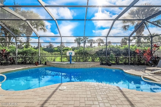 view of pool featuring a lanai and a patio