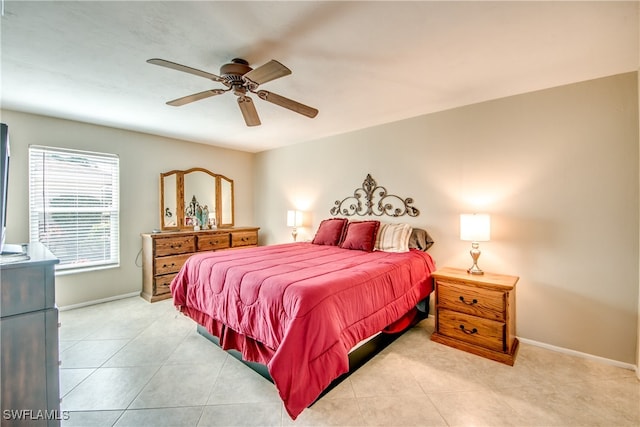 tiled bedroom featuring ceiling fan