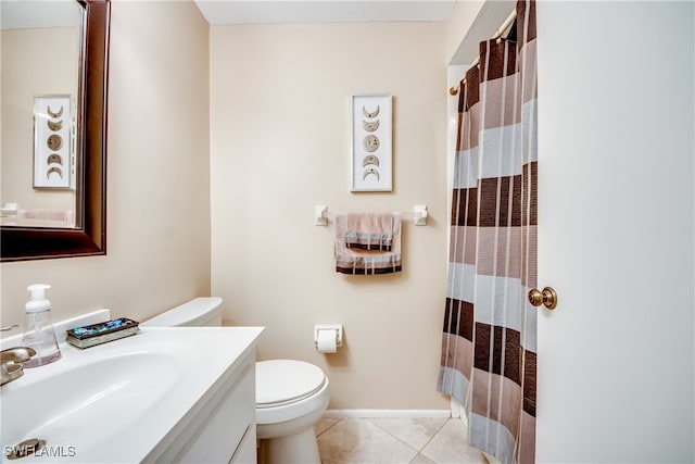 bathroom with walk in shower, vanity, tile patterned flooring, and toilet