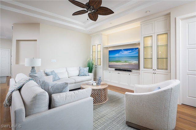 living room featuring ceiling fan and light wood-type flooring